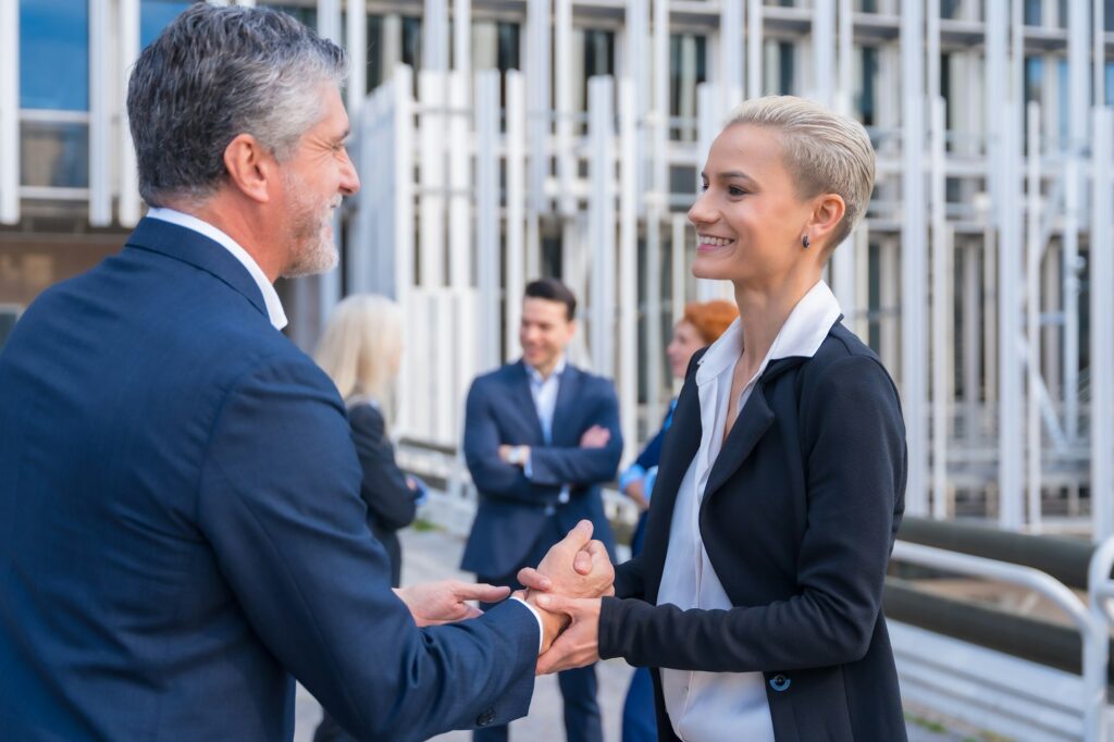 Business Leaders Shaking Hands in a Modern Metropolitan Setting